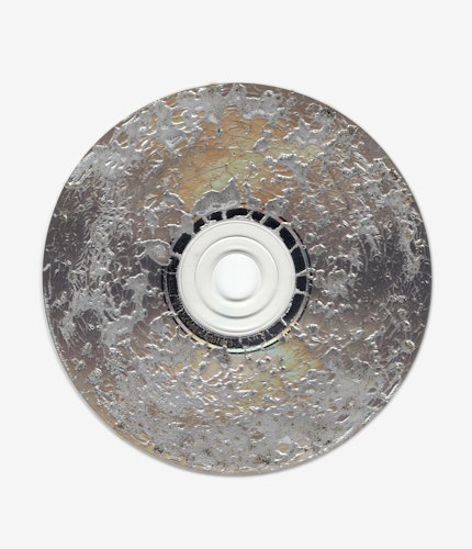 This artwork is part of the series “Free Software”, a body of work inspired by the YouTube genre of putting unusual things in a microwave. One of the most intriguing items is a CD. When microwaved, CDs create a little lightning storm inside the microwave. After being zapped the disk emerges with a unique and mesmeric fractal pattern burned into it. 

For the NFT, Kneale uses a high resolution scanner to make 4800 dpi scans of the burned disks, translating the intricate detail of the CD, and creating rainbow effects in the reflective surface.