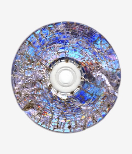 This artwork is part of the series “Free Software”, a body of work inspired by the YouTube genre of putting unusual things in a microwave. One of the most intriguing items is a CD. When microwaved, CDs create a little lightning storm inside the microwave. After being zapped the disk emerges with a unique and mesmeric fractal pattern burned into it. 

For the NFT, Kneale uses a high resolution scanner to make 4800 dpi scans of the burned disks, translating the intricate detail of the CD, and creating rainbow effects in the reflective surface.